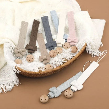 Attache tetine tissus papion